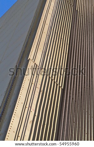 Abstract of portion of Sacramento Tower Bridge of Steel cables over gold painted metal plate