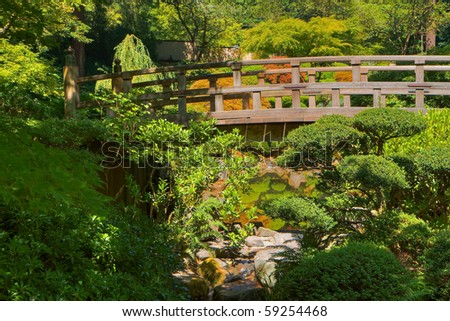 HDR image of Japanese Wood Bridge in garden of green and gold trees