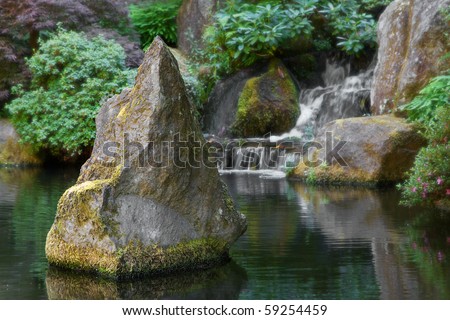 Spiked Boulder in the middle of a  Waterfall pond