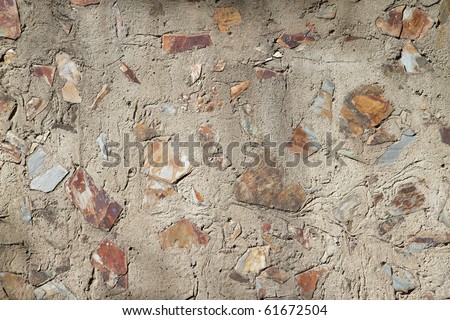 Concrete and mix of red and gray flat rocks and stones
