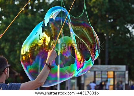 the man let a big bubble in the street
