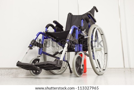 Wheel chair in hospital corridor