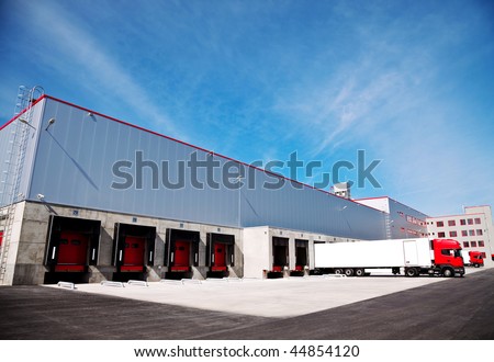 truck in front of an industrial logistics building