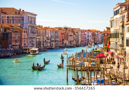 Amazing view on the beautiful Venice. Many gondolas sailing down one of the canals in Venice, Italy.