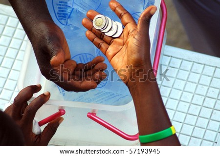 Money changing hands on the street of ghana