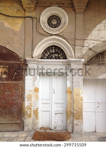 Al Salt, Jordan - Summer 2013: A traditional entry door to a residential building at the heart of the city of Alsalt, Jordan.
