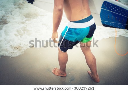 surfers running into the sea with surf boards on patong puket thailand,vintage Instagram retro hipster