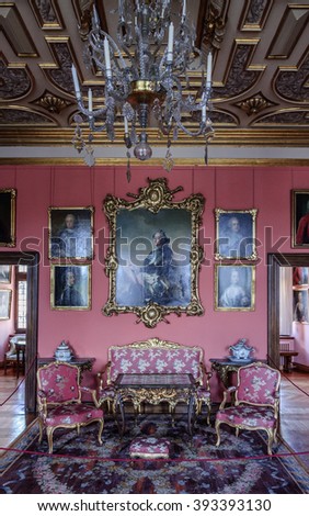 HILLEROD, DENMARK - 2014 JUN 08: Interior (One of the rooms of Frederiksborg Castle). Room with antique wooden floors, in the center - furniture group with a tea table and old chairs.