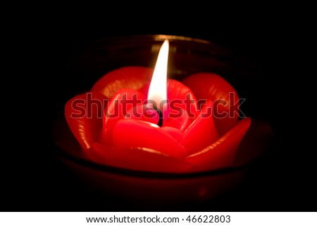 Candle in the form of red rose