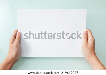 hands holding blank A4 copy space letter
