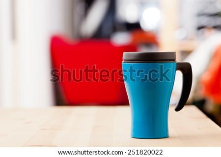 Coffee cup on wooden table.