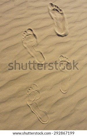 Feet Imprints in Sand
