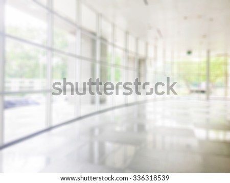 Blurred abstract background interior view looking out toward to empty office lobby and entrance doors