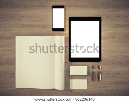 Open magazine, tablet, business cards cover with blank white page mockup on vintage wooden substrate High resolution