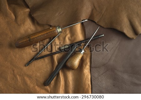 Leather craft. Leather  crafting tools on a work table.