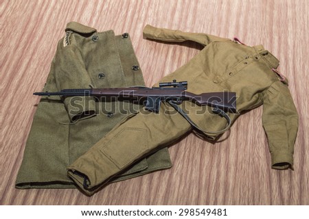 soviet uniform soldiers accessory and gun for toy scale on woods texture and woods backgrounds