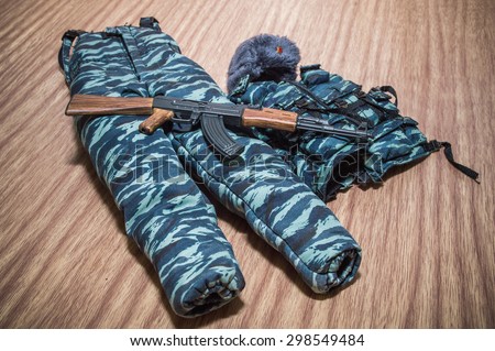 police russia uniform soldiers accessory and gun for toy scale on woods texture and woods backgrounds