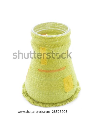 Vase in the knitted cloth on a white background