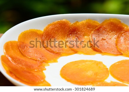 Thailand Dessert - Dried Mango Sheets on white dish