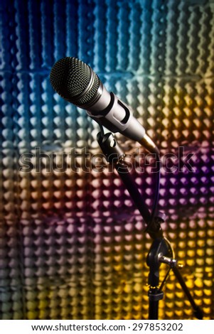 Modern microphone on a stand, recording studio, microphone picture, sound wall, microphone stand, mesh wire, close-up shot, vertical image, images in bright colors.