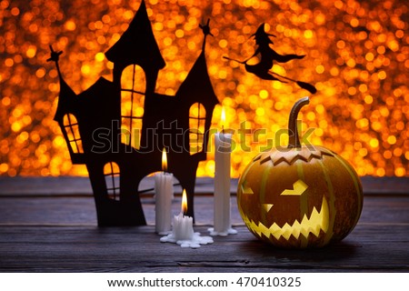 Pumpkin for Halloween, lamp pumpkin, antique wood, silhouette of a witch flying on a broom, celebrate halloween, smiley on a pumpkin, paraffin candles, angry face, silhouette of the castle