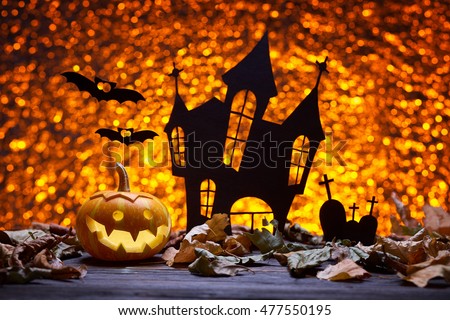 Pumpkin for Halloween, lamp pumpkin, antique wood, bat silhouette, celebrating halloween, smiley on pumpkin, silhouette of the cemetery, silhouette of the castle, autumn dry leaves, bright background