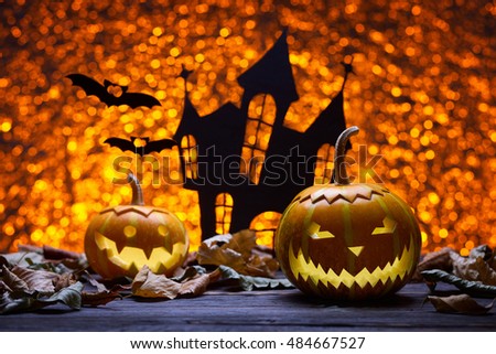Pumpkin for Halloween, lamp pumpkin, antique wood, bat silhouette, celebrating halloween, smiley on pumpkin, funny and angry face, the silhouette of the castle, autumn dry leaves, bright background