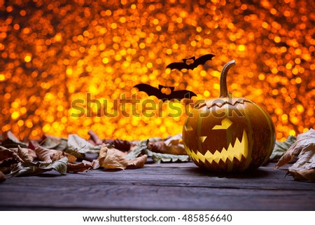 Pumpkin for Halloween, lamp pumpkin, bat silhouette, antique wood, celebrate Halloween, pumpkin smiley on a bright background, angry face