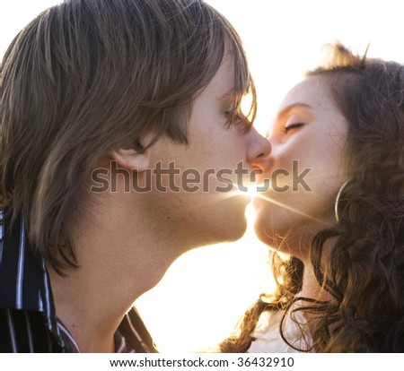 couple kissing images. of a young couple kissing