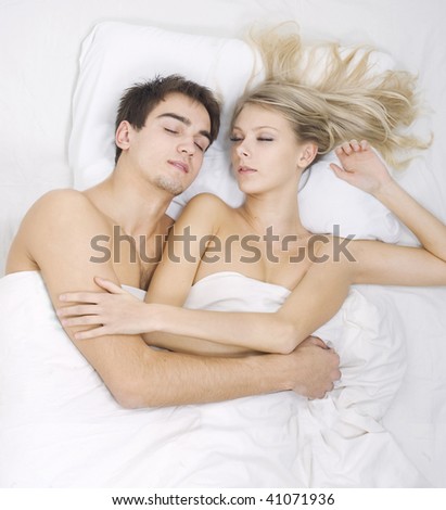 Couple sleeping together. Woman with three hands.