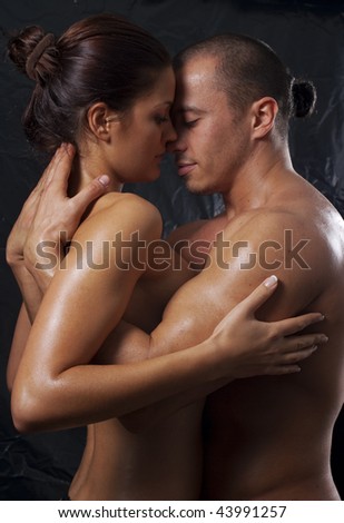 stock photo Loving affectionate nude heterosexual couple engaging in 