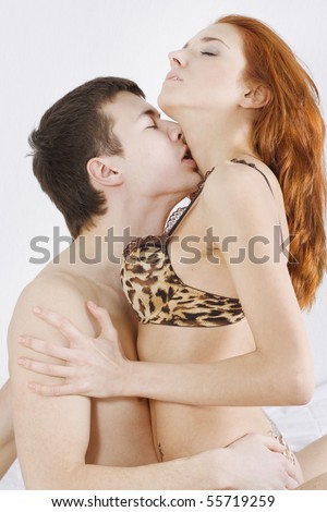 stock photo Loving affectionate nude heterosexual couple on bed in 