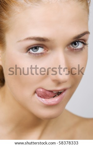 stock photo Sexy beautiful woman sticking her tongue out