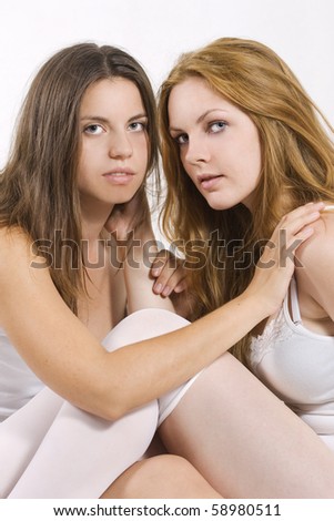 stock photo Two sexy beautiful lesbian women on bed