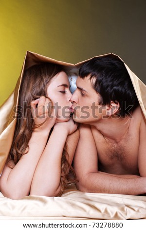 stock photo Young sexy heterosexual couple making love in bed