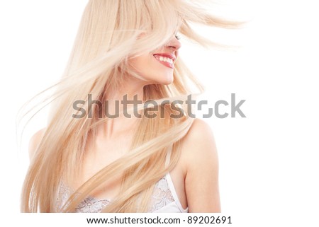 Portrait of beautiful woman with long blond hair over white