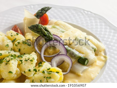 Asparagus baked with cheese served with buttered potatoes  *** also as a video in my portfolio