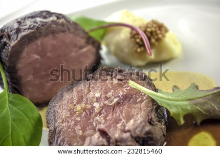 Beef tenderloin steak prepared Ã?Â?Ã?Â¡ la sous vide on Dijon mustard with homemade potato cream and olive oil