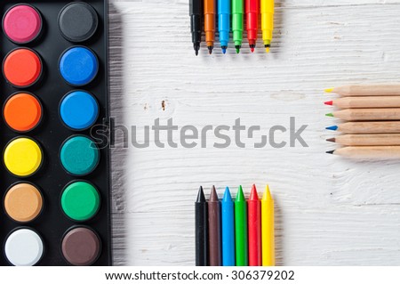 School supplies on white wood background ready for your design