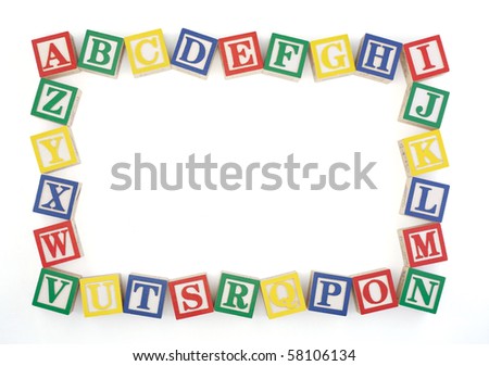 stock photo : Wooden alphabet blocks arranged to create an horizontal frame 