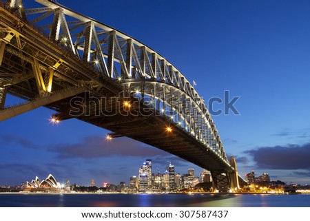 The Harbour Bridge, Sydney Opera House and Central Business District of Sydney. Photographed at dusk.