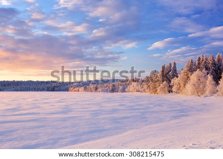 A beautiful lake in Finnish Lapland in Winter. Photographed at Ã?ijÃ¤jÃ¤rvi at sunset.