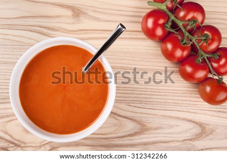 Top view of a bowl with tomato soup.