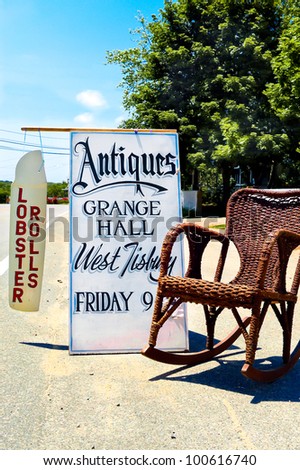 Signs for summer antique sale and lobster rolls in Martha\'s Vineyard, Massachusetts, USA