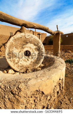 Old stone olive press for making olive oil, no longer functional.  Location: Remote rural village in Eastern Morocco