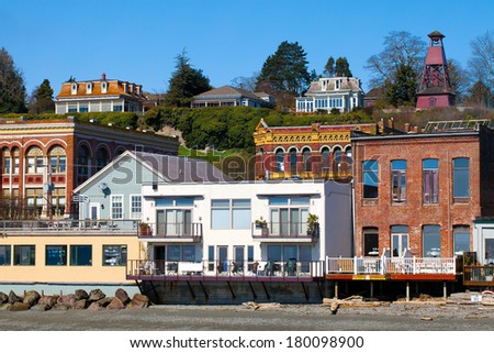 Port Townsend, Washington waterfront view of old Victorian era architecture on a clear sunny day with blue sky. Tourist destination on the Olympic Peninsula in the northwest USA.