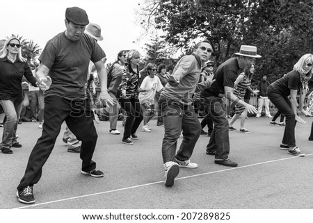 SAN FRANCISCO-JULY 13, 2014:Swing dancing in Golden Gate Park, a weekly Sunday tradition that includes a lesson.The free event attracts all ages, couples and people willing to dance with strangers.