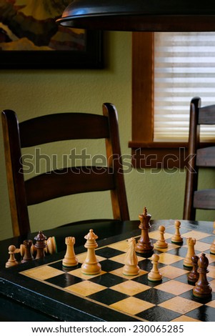 Chess game on a vintage board, with pieces in checkmate position