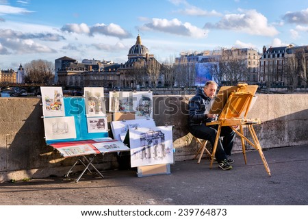 PARIS-JAN 2, 2014: A painter with an easel and a display of his work for sale on Pont Neuf, the oldest bridge over the Seine. The domed Institut de France is seen in the background. Morning side light