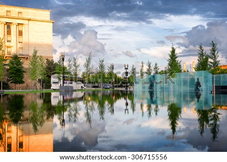 WASHINGTON DC- MAY 28,2015: Memorial to American Veterans Disabled for Life, dedicated October 2014.Glass panels with etched images and words called Voices of Veterans viewed across a reflecting pool.